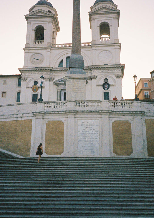 Fine art print of a sunlit stone staircase in a quiet Italian village, titled “La Scalinata.” Featuring warm textures, rustic architecture, and soft Mediterranean light, this image evokes a timeless, cinematic charm—ideal for classic, European-inspired interiors.