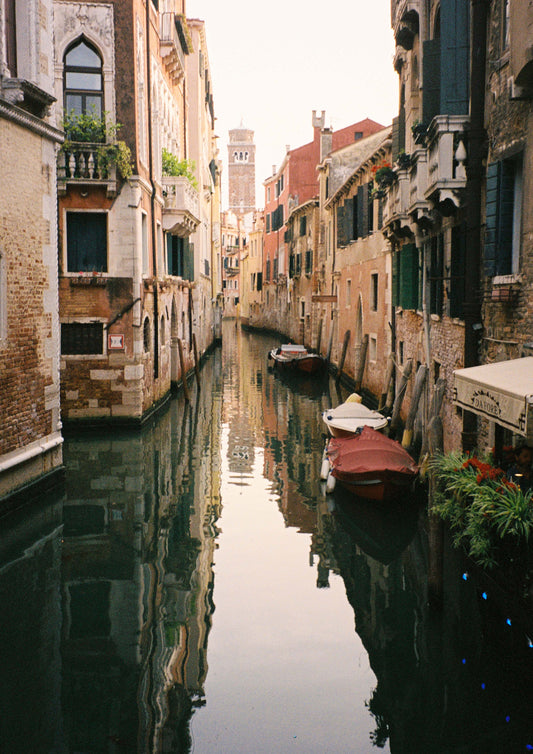 Fine art print titled “La Serenissima,” depicting a tranquil Venetian canal with softly rippling water, historic facades, and gondolas gliding past. This image captures the timeless beauty and quiet grandeur of Venice—perfect for romantic, classical, or travel-inspired interior décor.