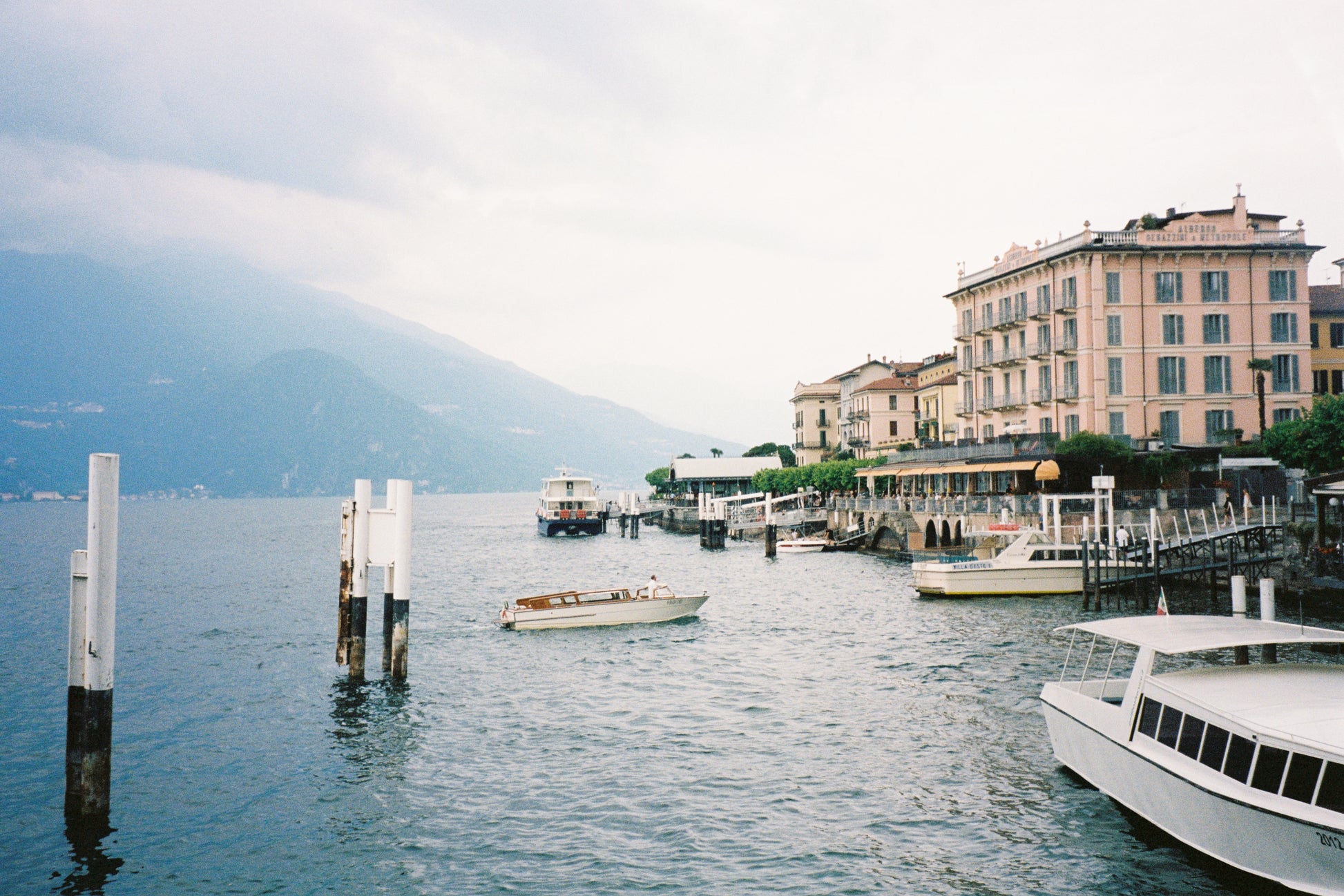 Elegant fine art photograph of Lake Como at golden hour, featuring soft pastel reflections on tranquil water and distant Alpine silhouettes. “Sfumature di Como” captures the refined serenity of Northern Italy, perfect for sophisticated, minimalist, or romantic home décor.