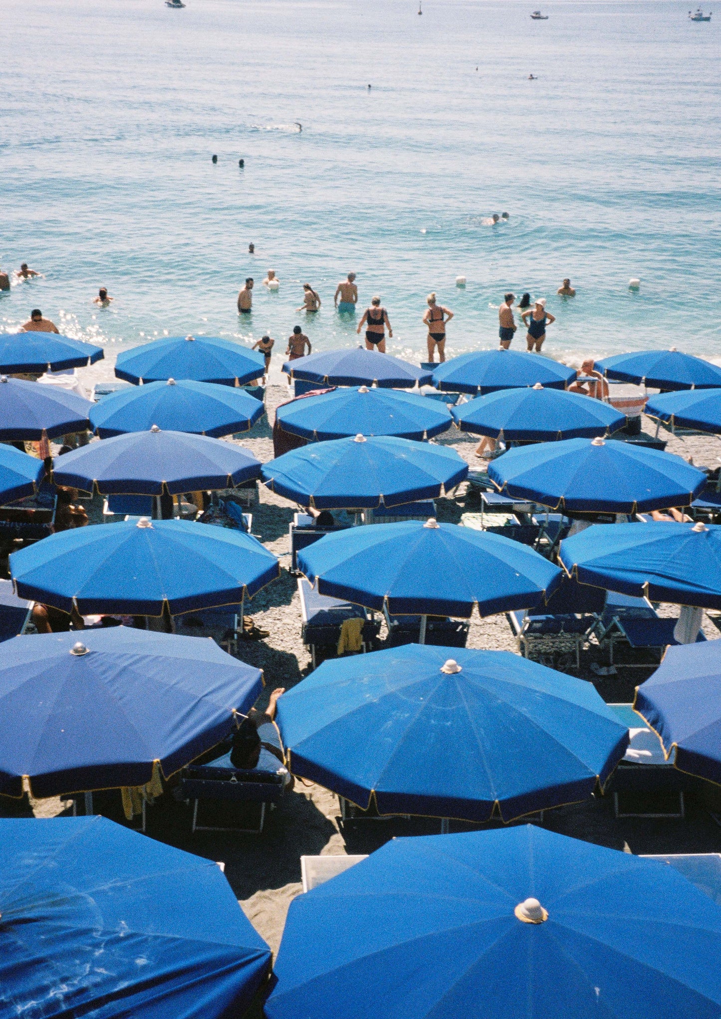 Fine art photograph titled “Blu Mediterraneo,” showcasing the deep, vivid blues of the Mediterranean Sea under a clear sky. This minimalist seascape captures the essence of southern Europe’s coastal serenity—perfect for calming, nautical, or contemporary interior design.