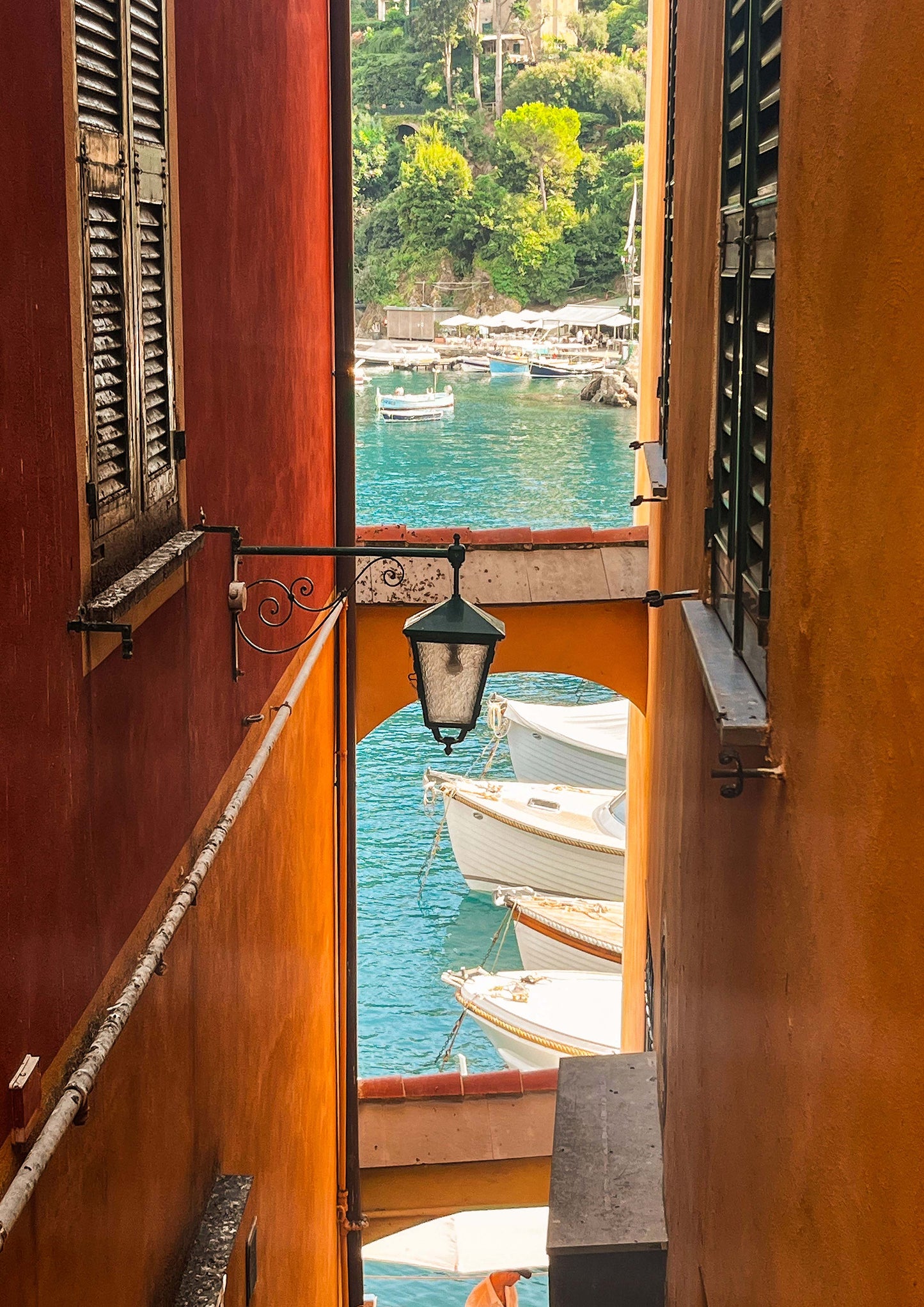 Fine art photograph of Calata Marconi, the picturesque waterfront promenade in Portofino, Italy. Featuring vibrant buildings, moored boats, and sparkling Ligurian waters, this image embodies the elegance and charm of the Italian Riviera—perfect for coastal, nautical, or luxury travel-themed décor.