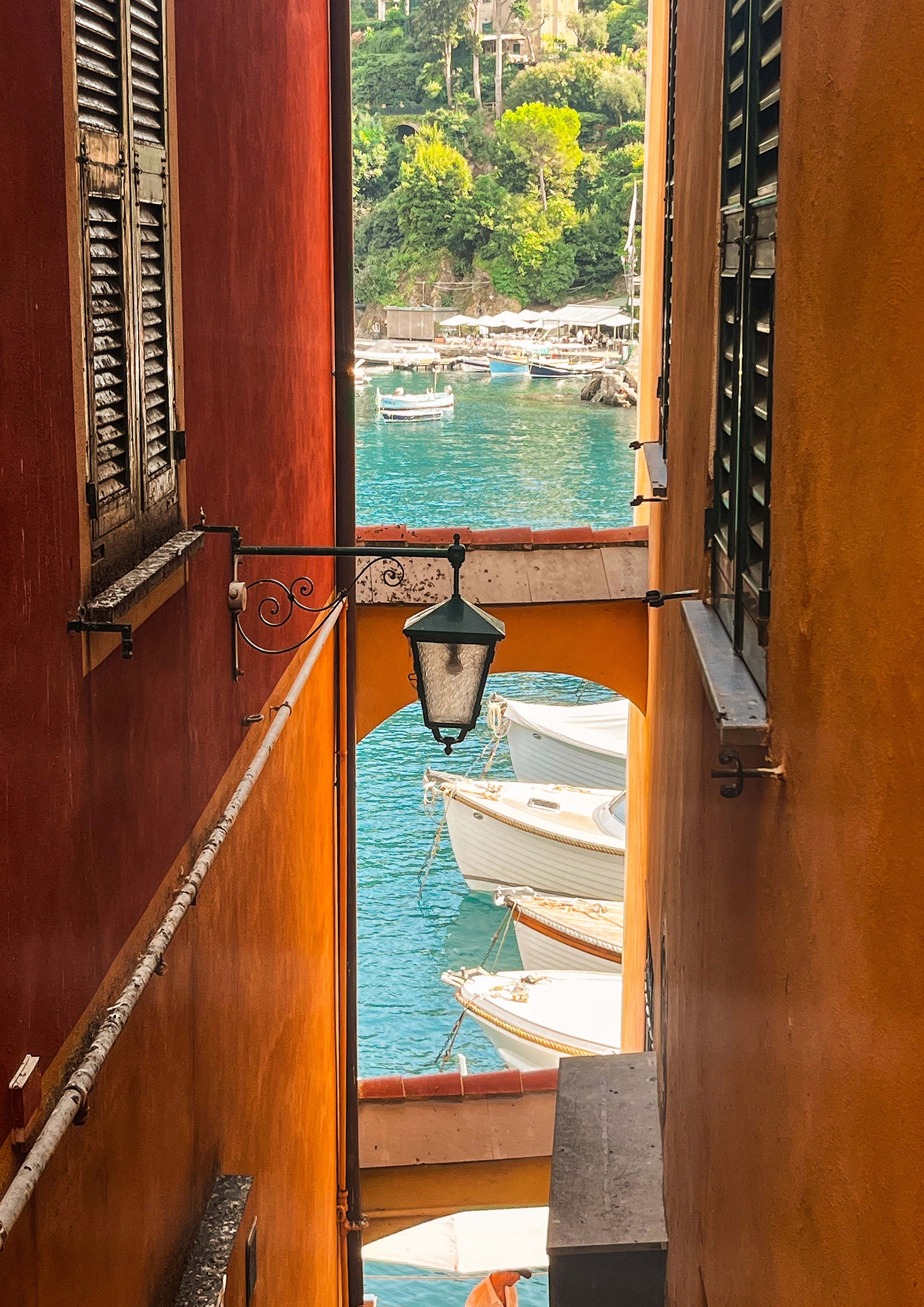 Fine art photograph of Calata Marconi, the picturesque waterfront promenade in Portofino, Italy. Featuring vibrant buildings, moored boats, and sparkling Ligurian waters, this image embodies the elegance and charm of the Italian Riviera—perfect for coastal, nautical, or luxury travel-themed décor.